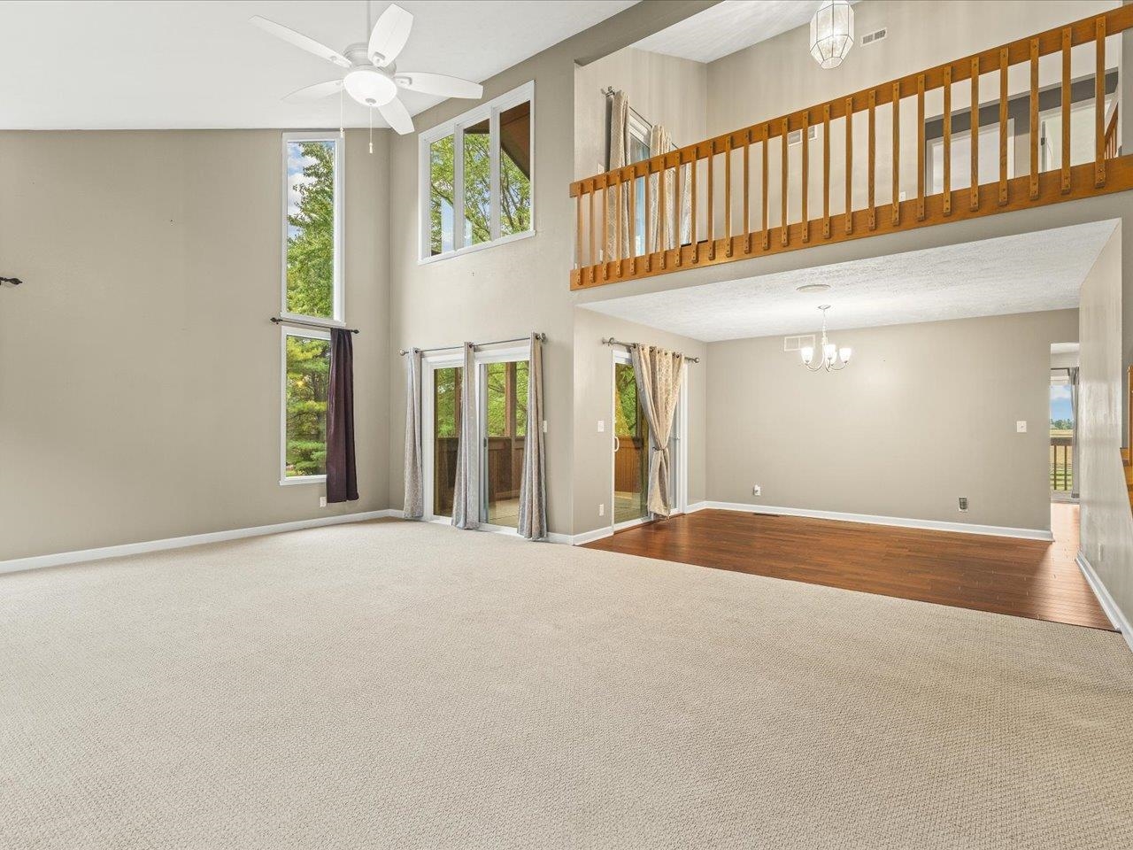 9104 East Weber Road Ridott, IL 61067 - Photo 3 of 96 a view of an empty room with wooden floor