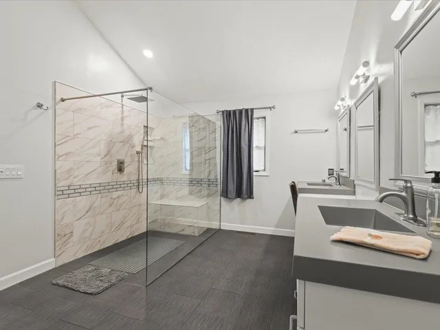 a kitchen with white cabinets