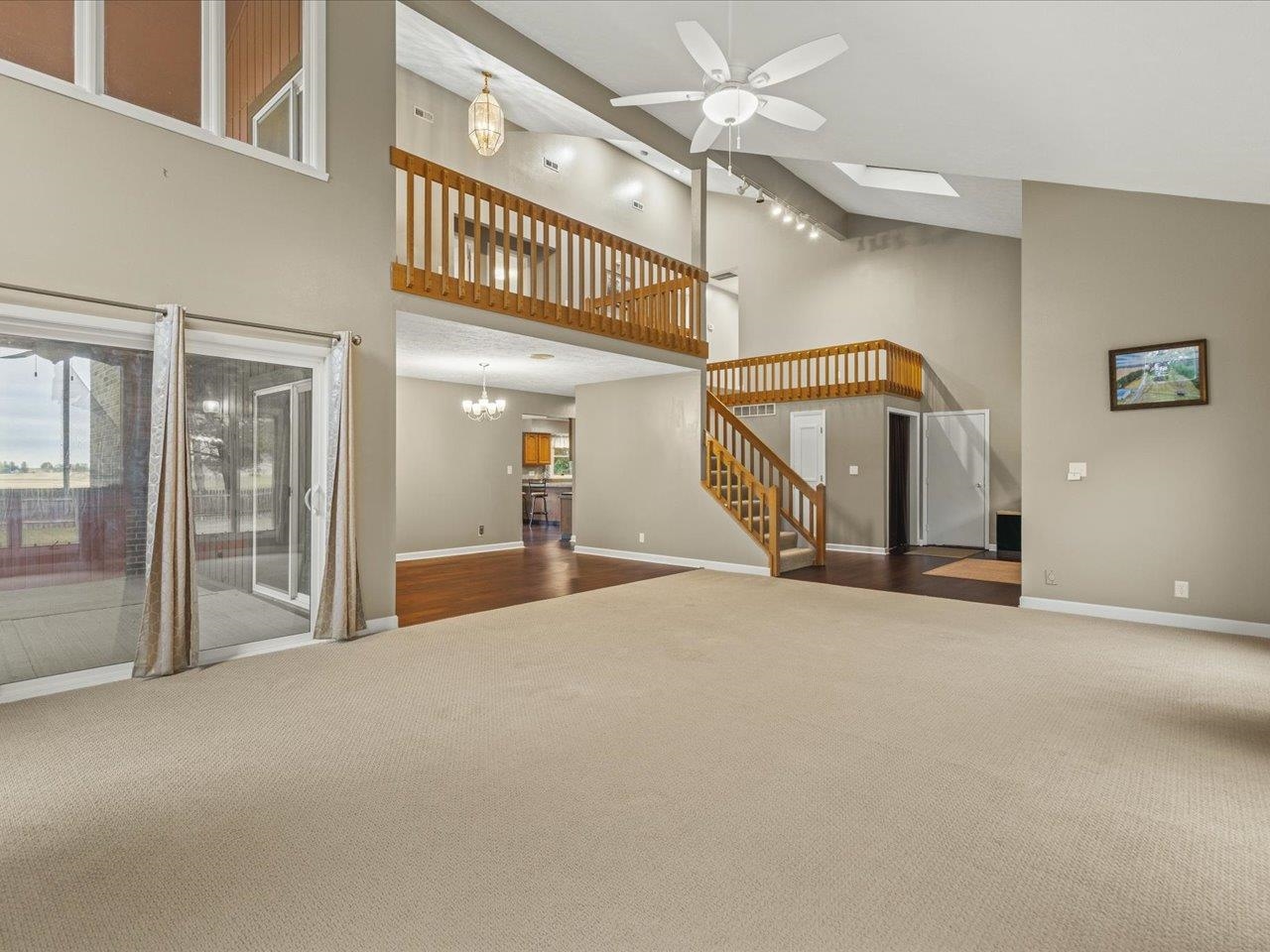 9104 East Weber Road Ridott, IL 61067 - Photo 4 of 96 a view of a hallway with a livingroom and stairs