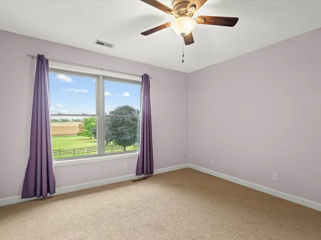 a view of a house with pool and sitting area