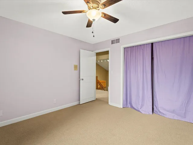 a view of a house with a yard balcony and sitting area