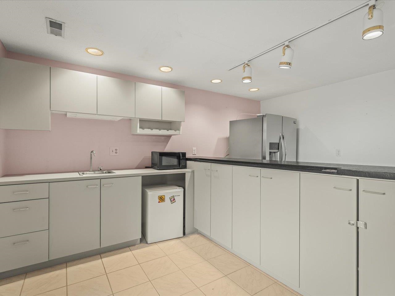 9104 East Weber Road Ridott, IL 61067 - Photo 44 of 96 a kitchen with white cabinets