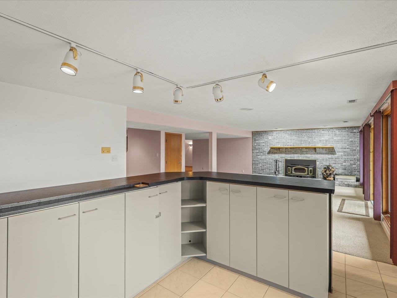 9104 East Weber Road Ridott, IL 61067 - Photo 45 of 96 a kitchen with granite countertop cabinets stainless steel appliances and a sink