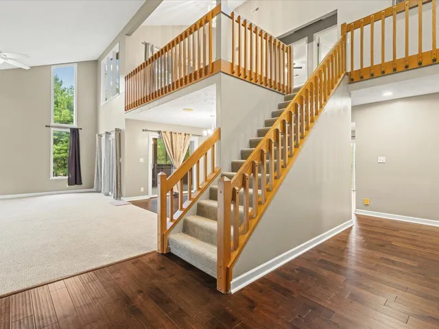 a view of staircase with wooden floor and stairs