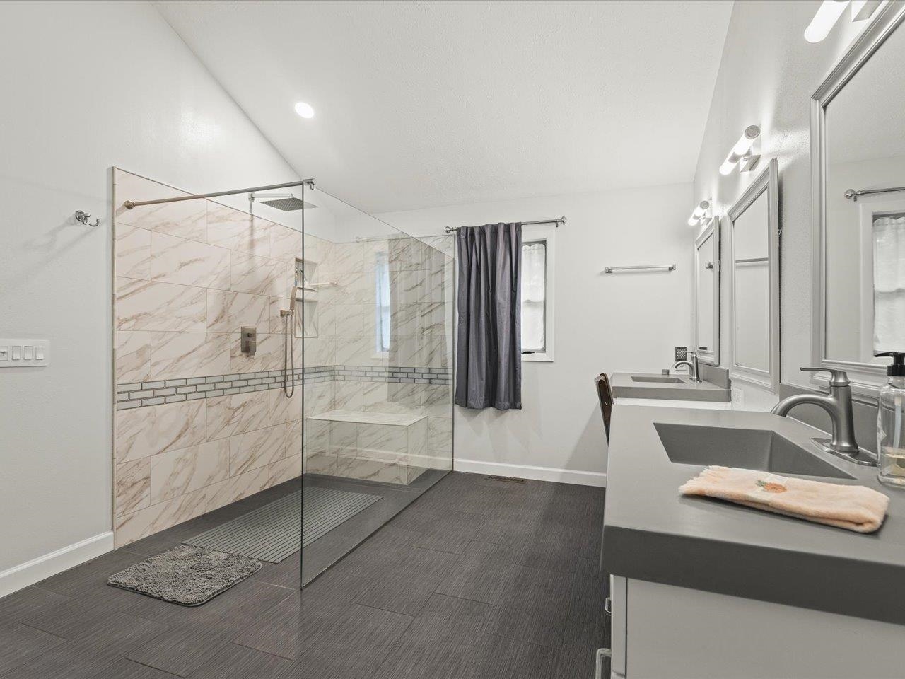 9104 East Weber Road Ridott, IL 61067 - Photo 79 of 96 a bathroom with a shower sink and mirror