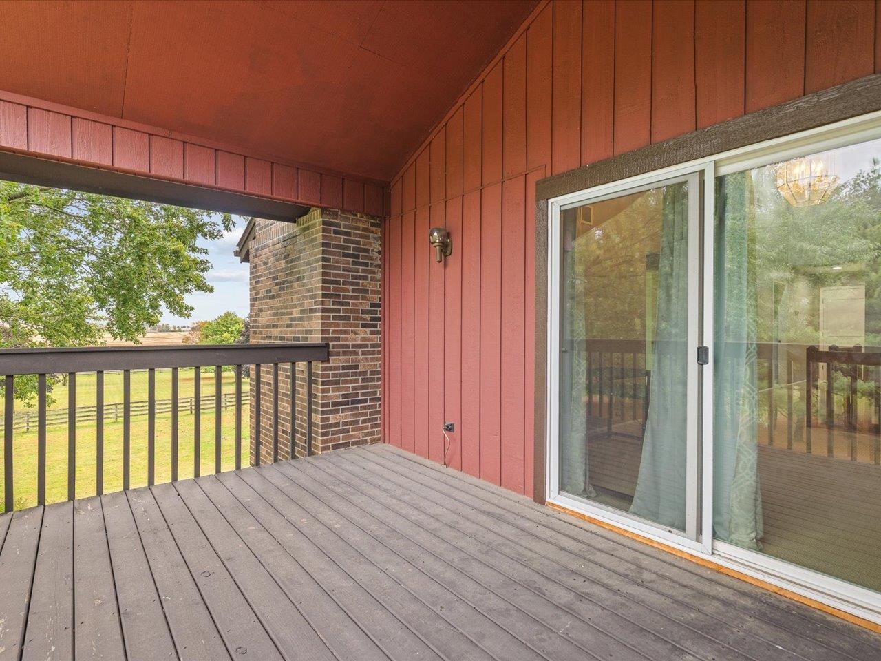 9104 East Weber Road Ridott, IL 61067 - Photo 85 of 96 a view of a balcony with wooden floor