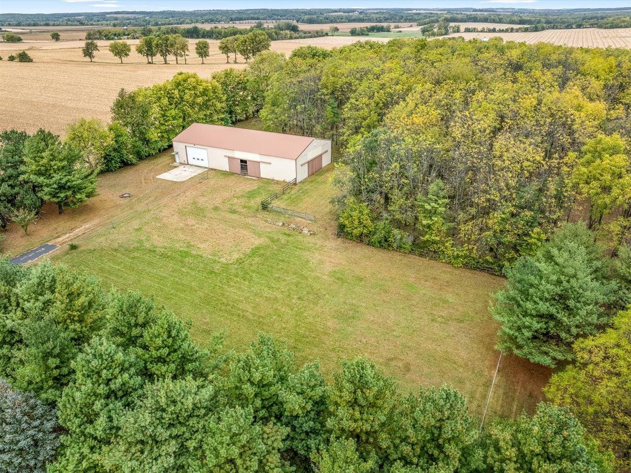 9104 East Weber Road Ridott, IL 61067 - Photo 93 of 96 a view of a lake with a big yard