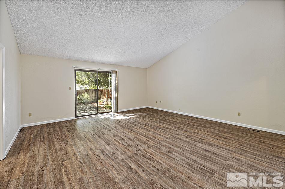 1600 Foster Drive Reno, NV 89509 - Photo 13 of 22 an empty room with wooden floor and windows