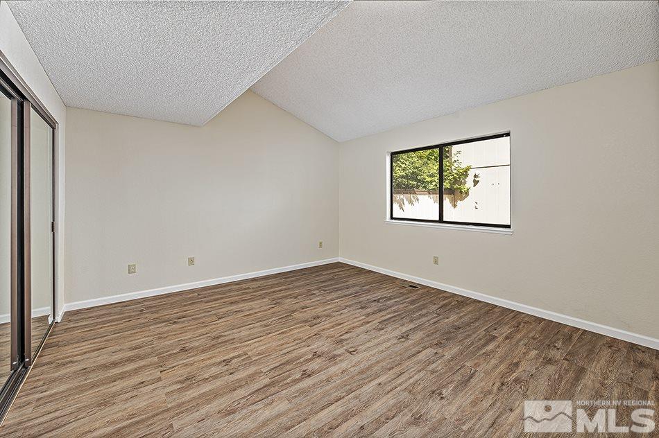 1600 Foster Drive Reno, NV 89509 - Photo 16 of 22 an empty room with wooden floor and windows