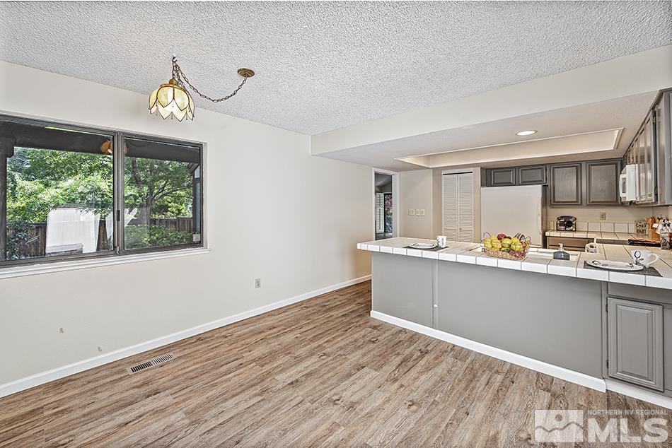 1600 Foster Drive Reno, NV 89509 - Photo 10 of 22 a view of kitchen with stainless steel appliances granite countertop cabinets and window