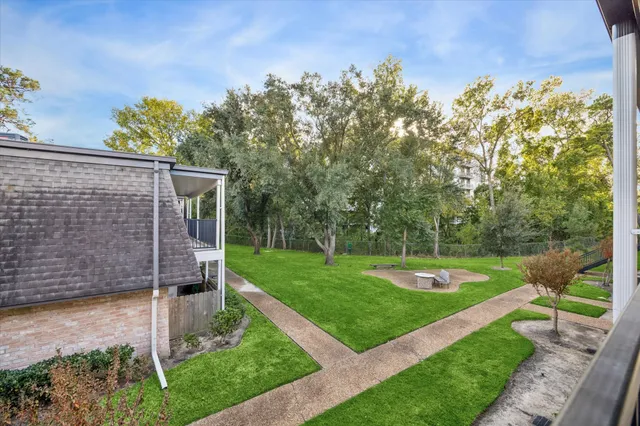 a view of a backyard with garden
