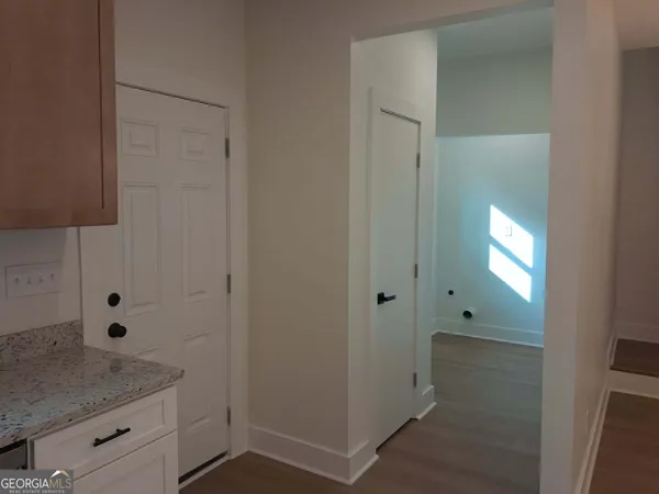 a room with a window and a ceiling fan