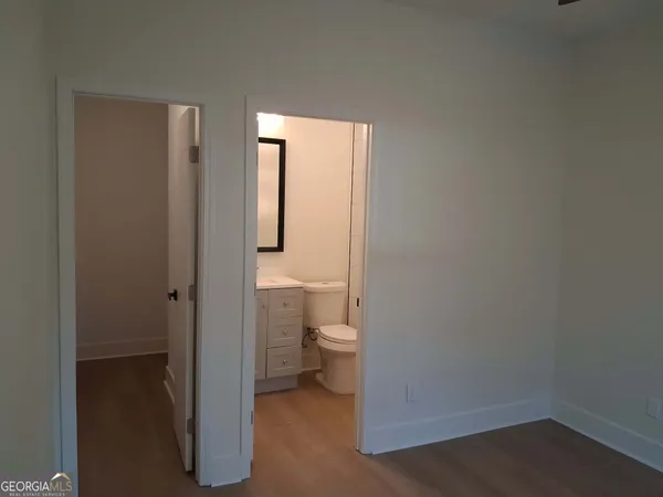 a bathroom with a shower and a sink