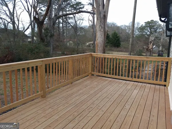 a view of balcony and yard