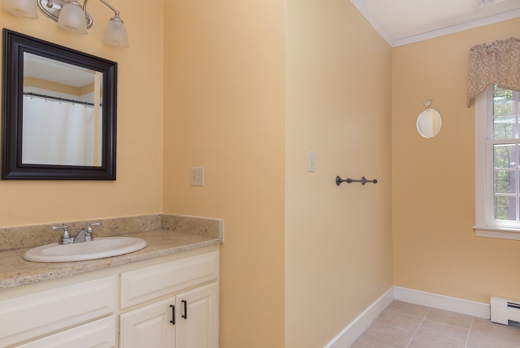 6 Leclair Drive Hingham, MA 02043 - Photo 19 of 26 a bathroom with a sink and a mirror