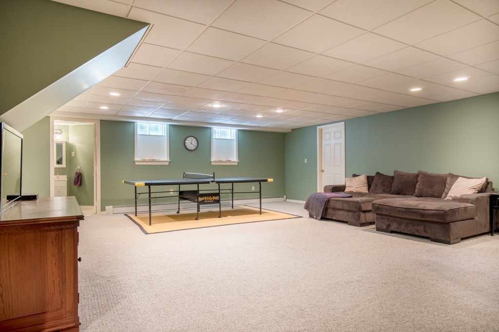 6 Leclair Drive Hingham, MA 02043 - Photo 22 of 26 a living room with furniture and a wooden floor
