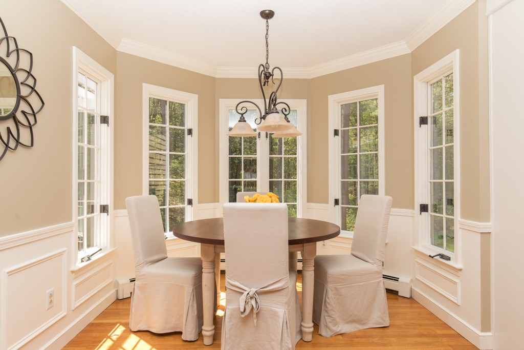 6 Leclair Drive Hingham, MA 02043 - Photo 6 of 26 a living room with furniture and a chandelier