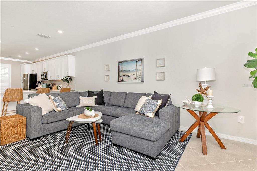 12280 Wellen Golf Street, Unit 403 Venice, FL 34293 - Photo 19 of 97 a living room with furniture a rug and a lamp