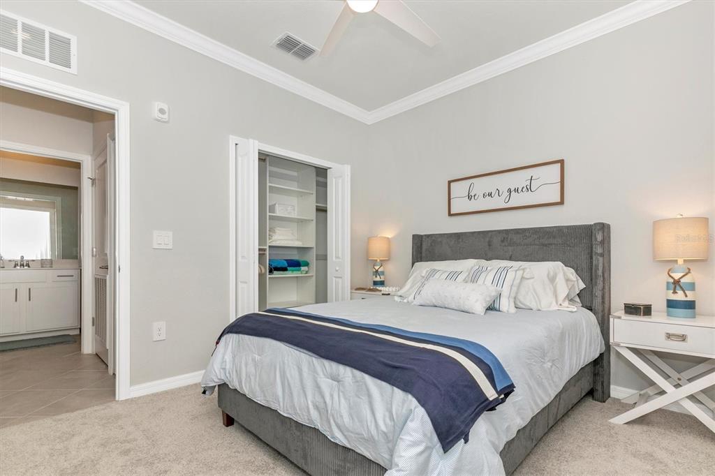 12280 Wellen Golf Street, Unit 403 Venice, FL 34293 - Photo 35 of 97 a bedroom with a bed and painting on the wall