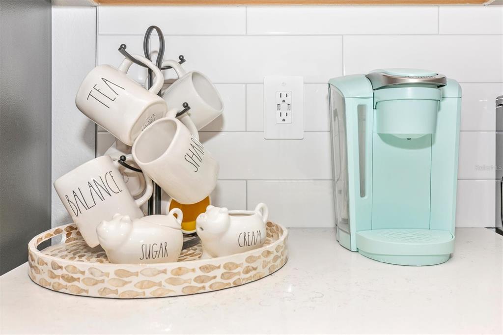 12280 Wellen Golf Street, Unit 403 Venice, FL 34293 - Photo 7 of 97 a view of a dining room with table chairs and a wooden floor