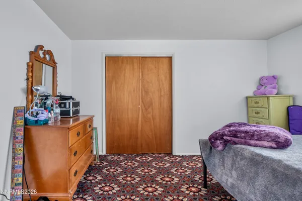 a swimming pool with outdoor seating and yard