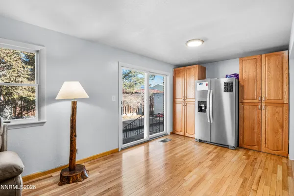 a view of livingroom with furniture wooden floor window and a chandelier