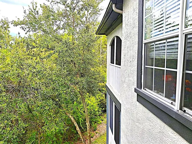 a view of a house with a tree