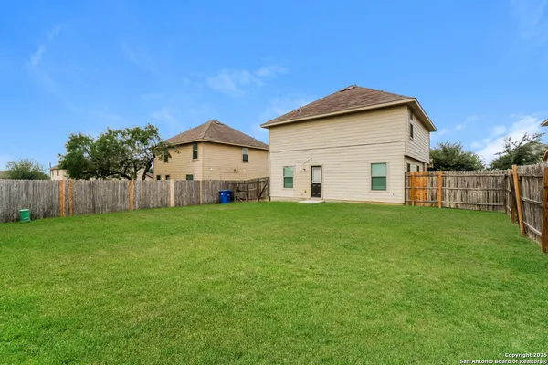a view of a house with backyard