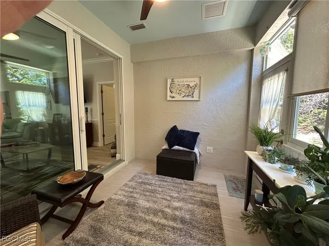 a bedroom with furniture and a window