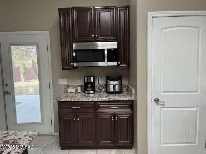 11553 East Tanque Verde Road Tucson, AZ 85749 - Photo 15 of 16 a kitchen with a sink and a microwave