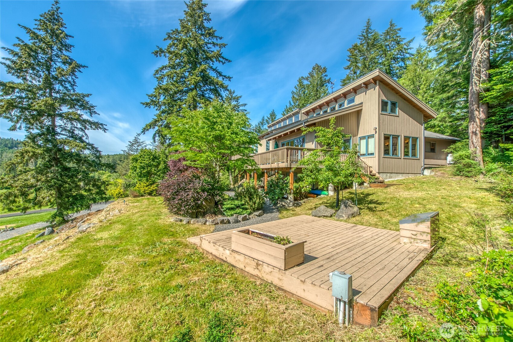 402 Cayou Valley Road Orcas Island, WA 98245 - Photo 11 of 40 a front view of house with yard and trees in the background