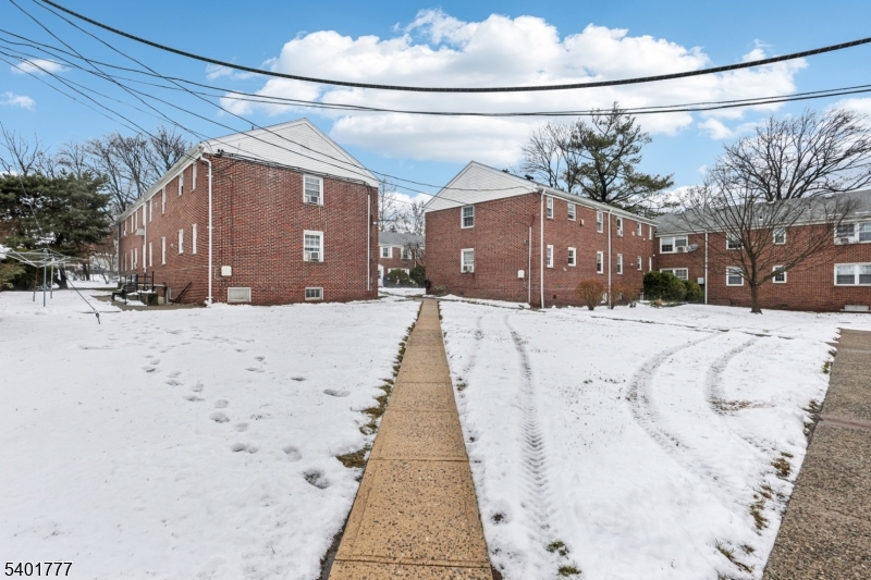 445 Morris Avenue, Unit D11 Springfield, NJ 07081 - Photo 15 of 16 a view of a house with a snow in the background