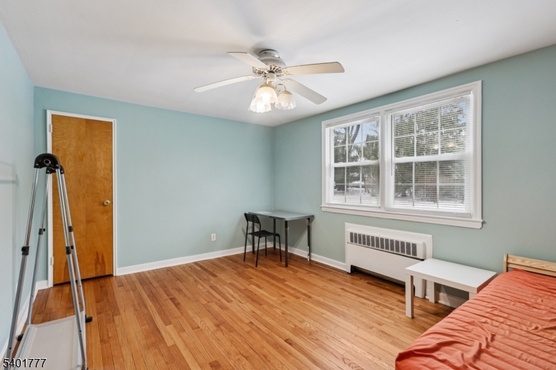 445 Morris Avenue, Unit D11 Springfield, NJ 07081 - Photo 10 of 16 a bedroom with furniture and a window