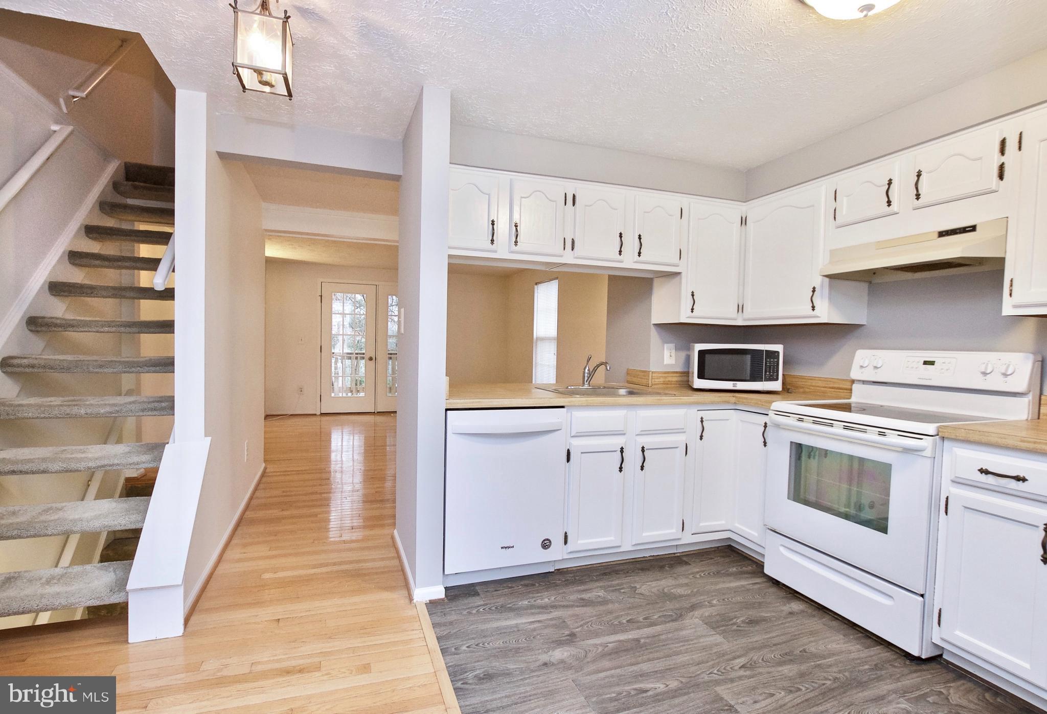1915 Belmont Ridge Court Reston, VA 20191 - Photo 10 of 34 HALLWAY FROM KITCHEN TO BACK OF THE HOUSE