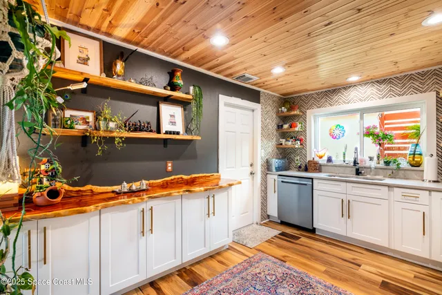 a kitchen with stainless steel appliances granite countertop a sink and cabinets