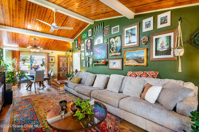 a outdoor living room with furniture and a potted plant