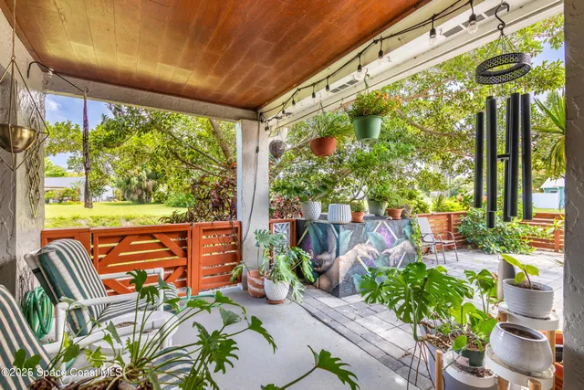 a view of a chairs and table in a patio