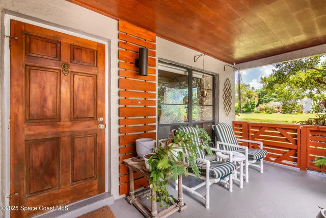 a view of a house with pool and garden