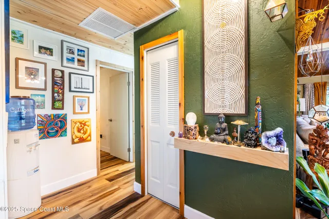 a bathroom with a sink a mirror and next to a window