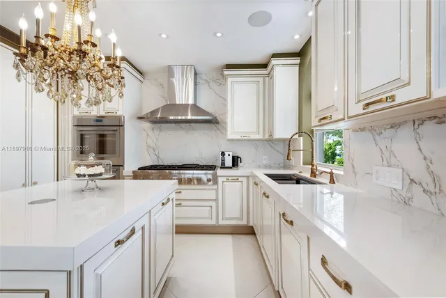 a kitchen with a sink a stove and cabinets