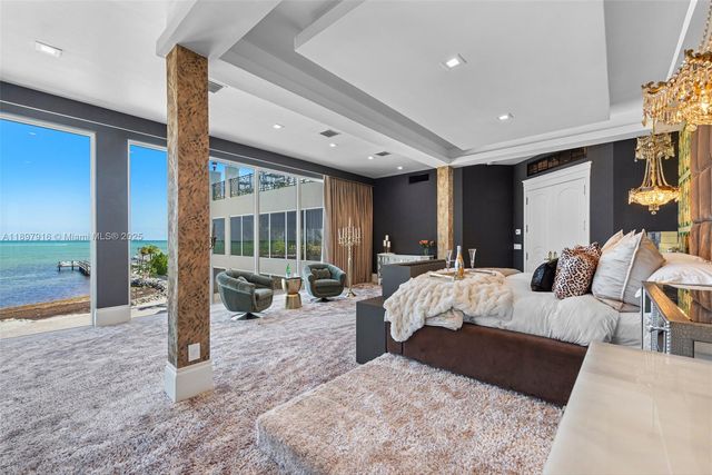 a bed room with a bed and glass door