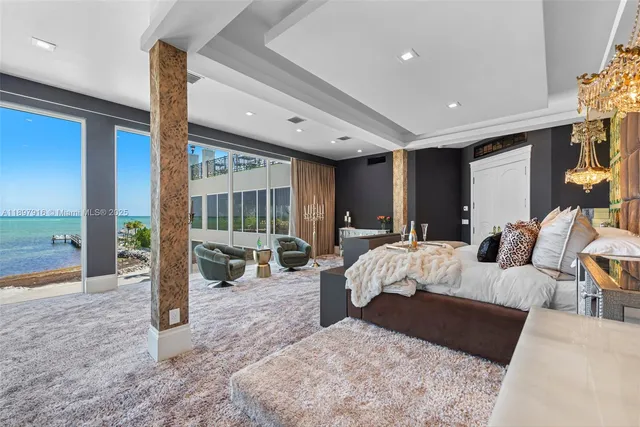 a bed room with a bed and glass door