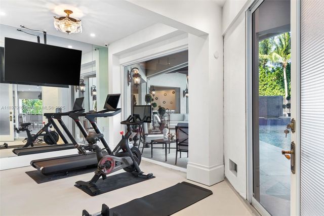 a view of a livingroom with furniture and a flat screen tv