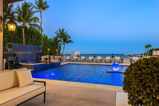a view of a swimming pool and lounge chair