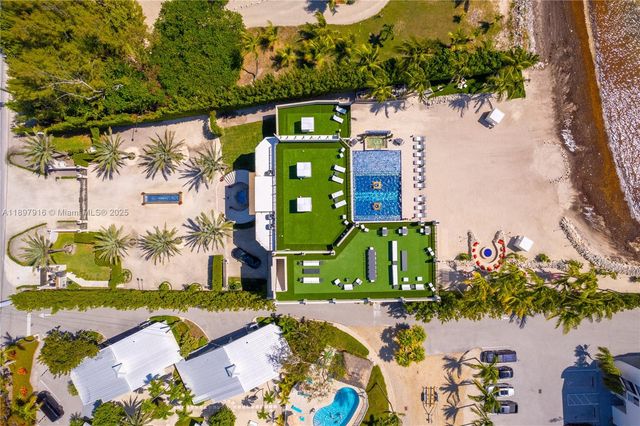 an aerial view of a house with a swimming pool