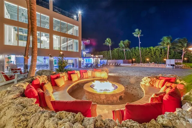 a view of a swimming pool with outdoor seating