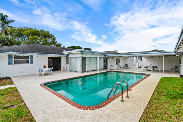 a bathroom with a sink a mirror and a shower