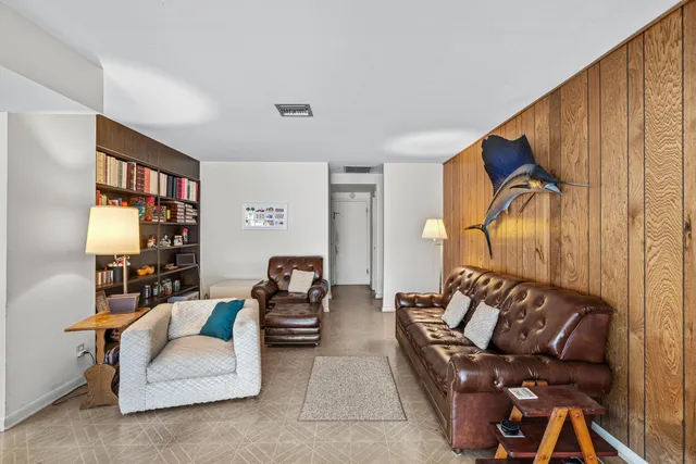 a bathroom with a sink a mirror a shower and a mirror