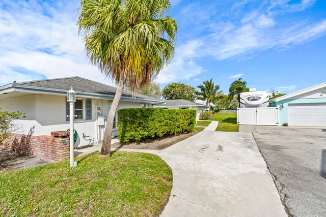 a view of a lake with houses in the back