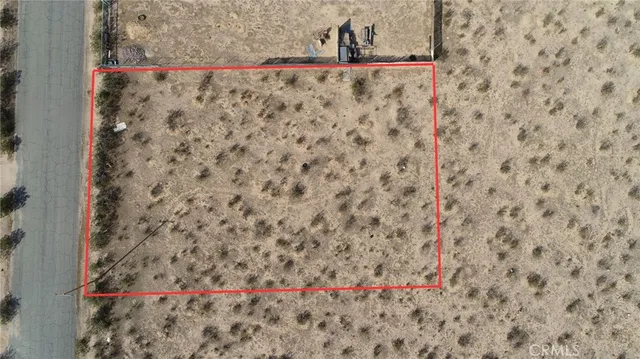 a view of a road with a building in the background